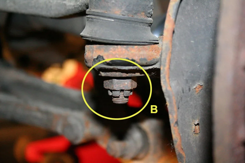 Remove the brake caliper and rotor