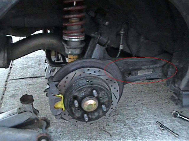 Identify the trailing arm and bushing