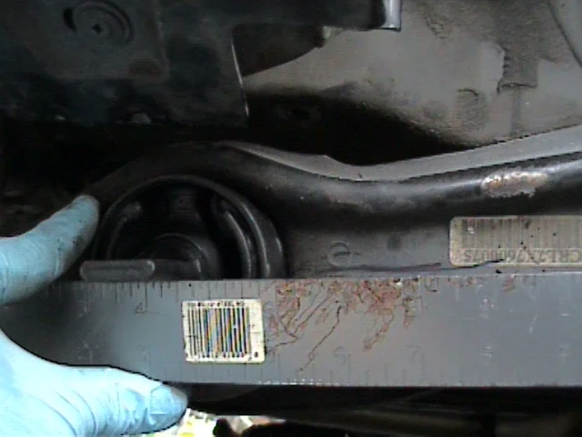 Remove the bushing shaft bolts and upper arm bolt