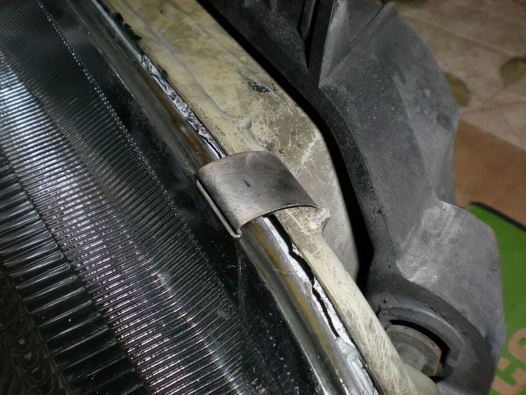 Release the lens retaining clips
