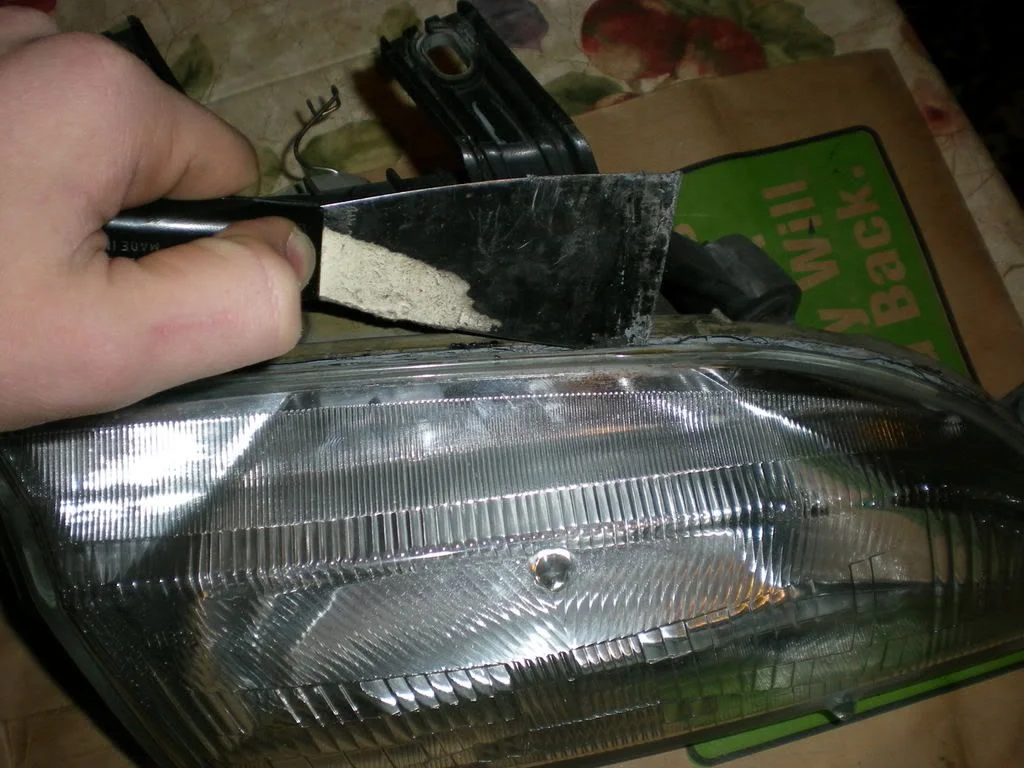 Bake the headlight and split the lens from the housing