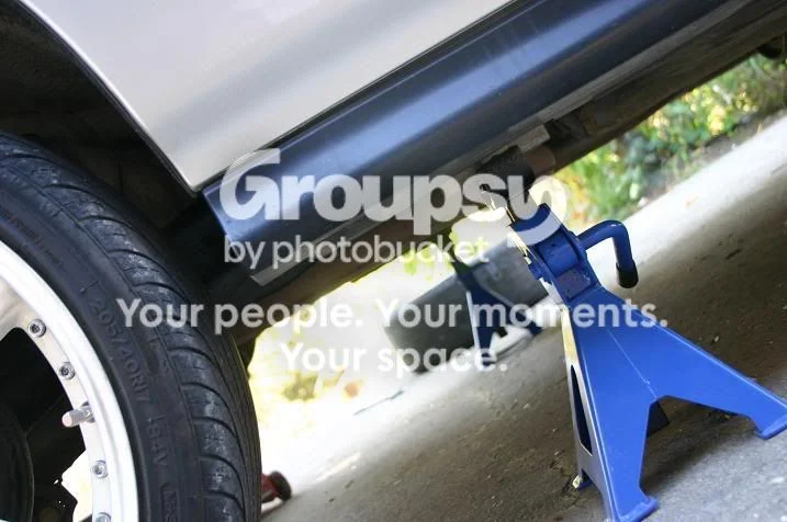 Remove the rear shock/spring assembly