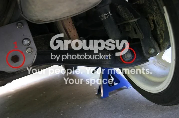 Disassemble the stock strut with a spring compressor