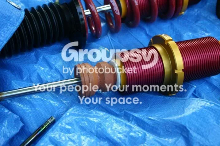 Assemble the top hat onto the new shock
