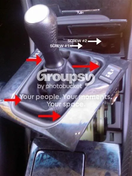 Remove the gear boot surround and ashtray assembly