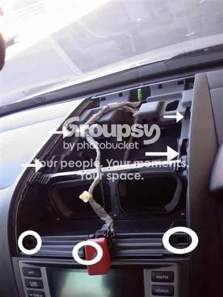 Lever off the center console top panel