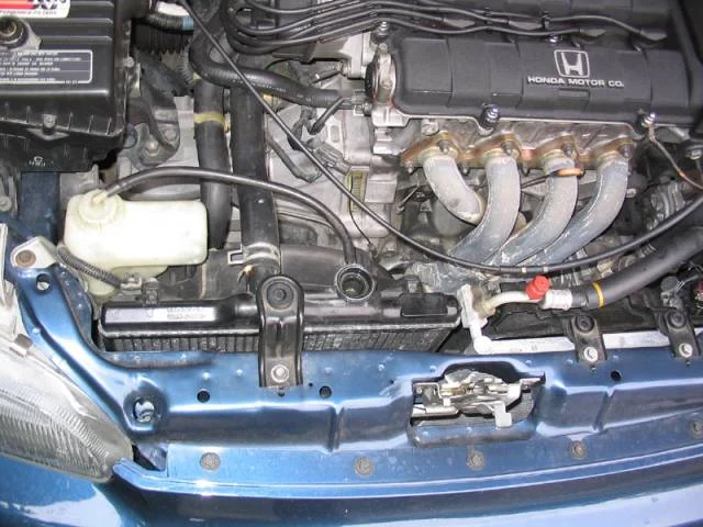 Remove the radiator cap and open the radiator drain